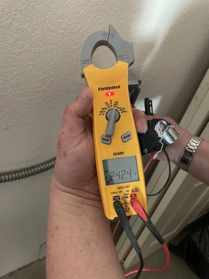 Voltage testing with clamp meter during Ceiling Fan Installation in Hayfield